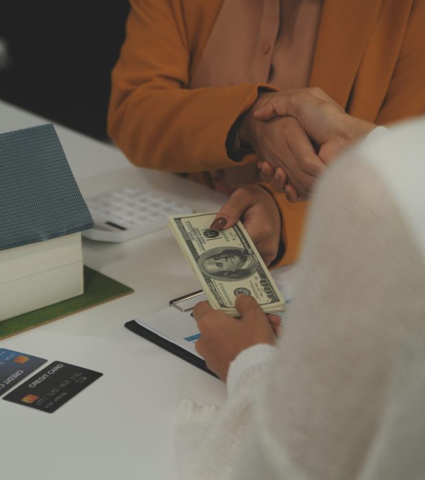 Discussion with a real estate agent, House model with agent and customer discussing for the contract to buy, get insurance or loan real estate or property.