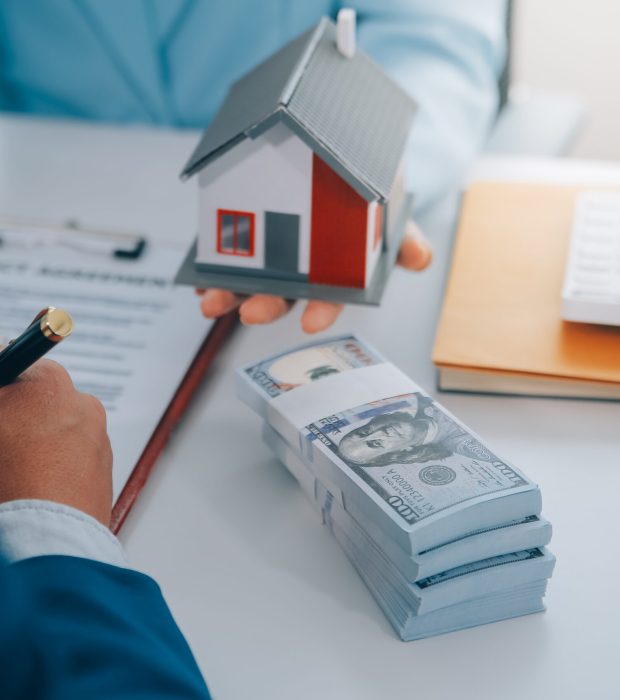 Real estate agent talked about the terms of the home purchase agreement and asked the customer to sign the documents to make the contract legally, Home sales and home insurance concept.